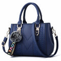 The Verona Signature Satchel