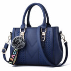 The Verona Signature Satchel